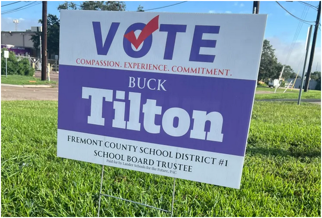 a campaign sign in a yard